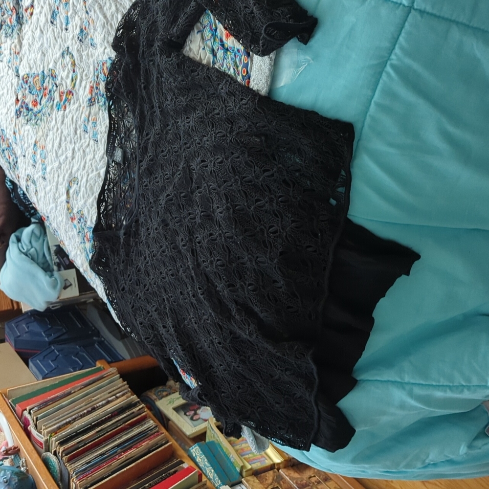 Crochet look sweater with attached black camisole